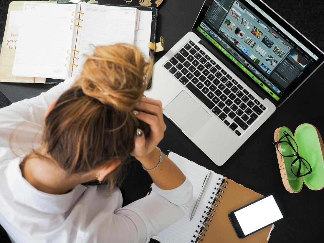 Person struggling with dry eyes at their computer