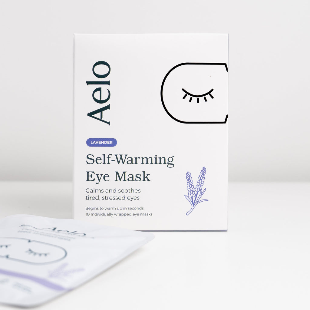 A box of Aelo Self-Warming Eye Mask that calm and soothe tired, stressed eyes.