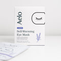 A box of Aelo Self-Warming Eye Mask that calm and soothe tired, stressed eyes.
