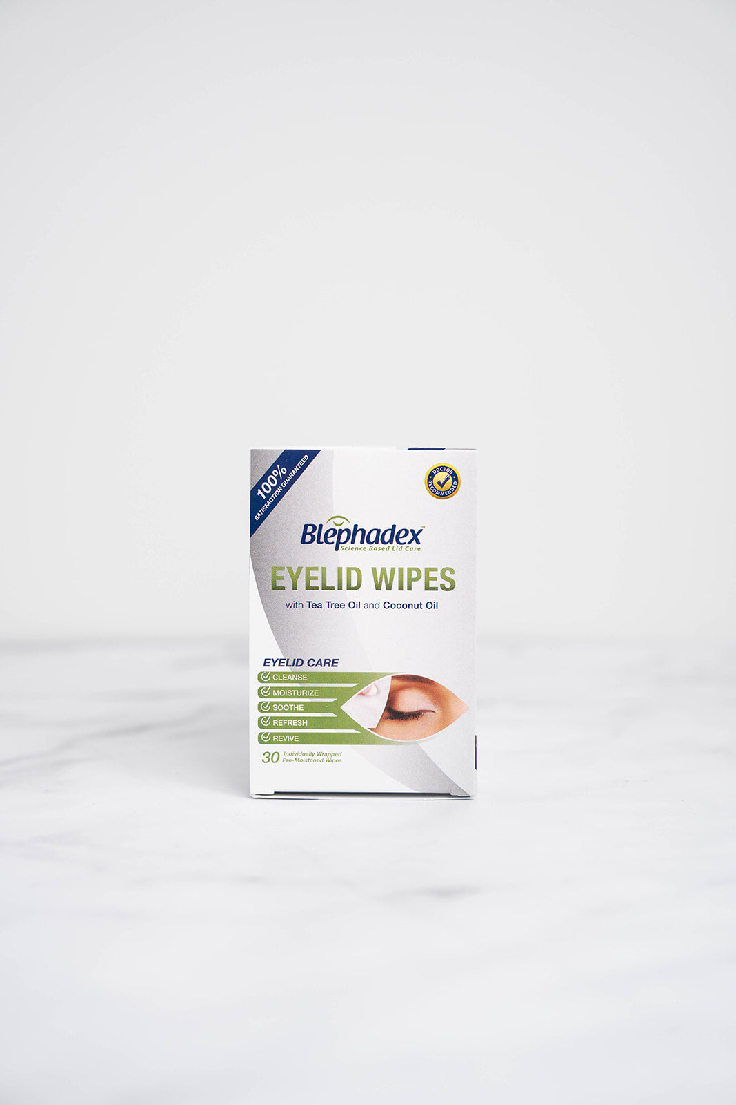 The front of a box of Blephadex Eyelid Wipes with Tea Tree Oil & Coconut Oil in a bathroom.