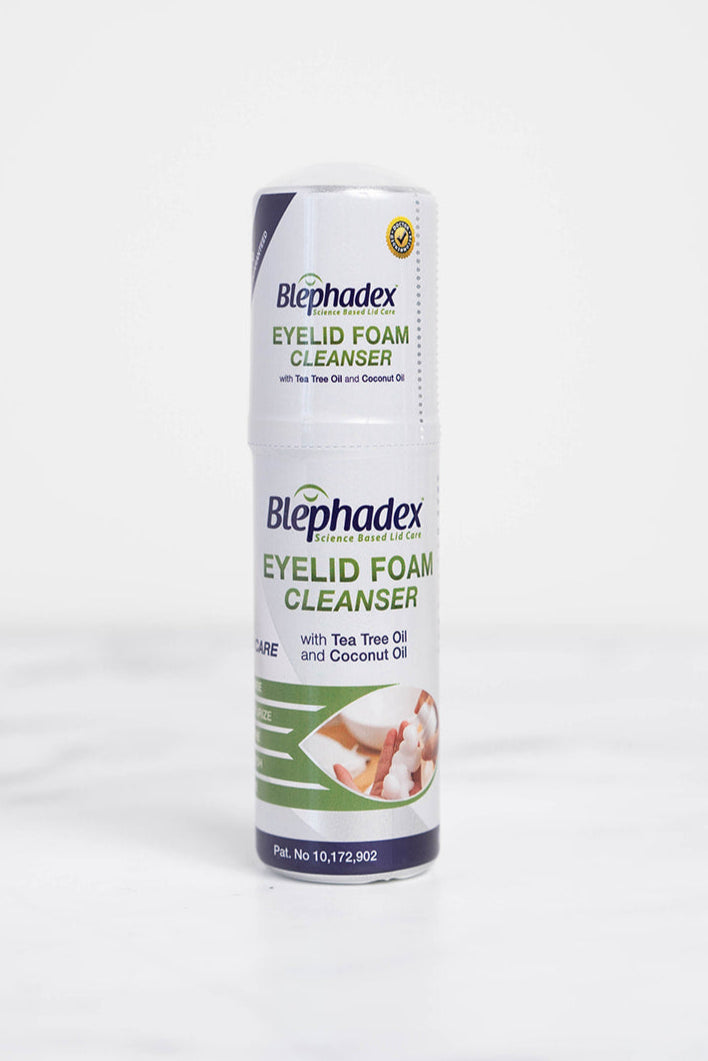 A bottle of Blephadex Eyelid Foam with Tea Tree Oil & Coconut Oil in a bathroom.