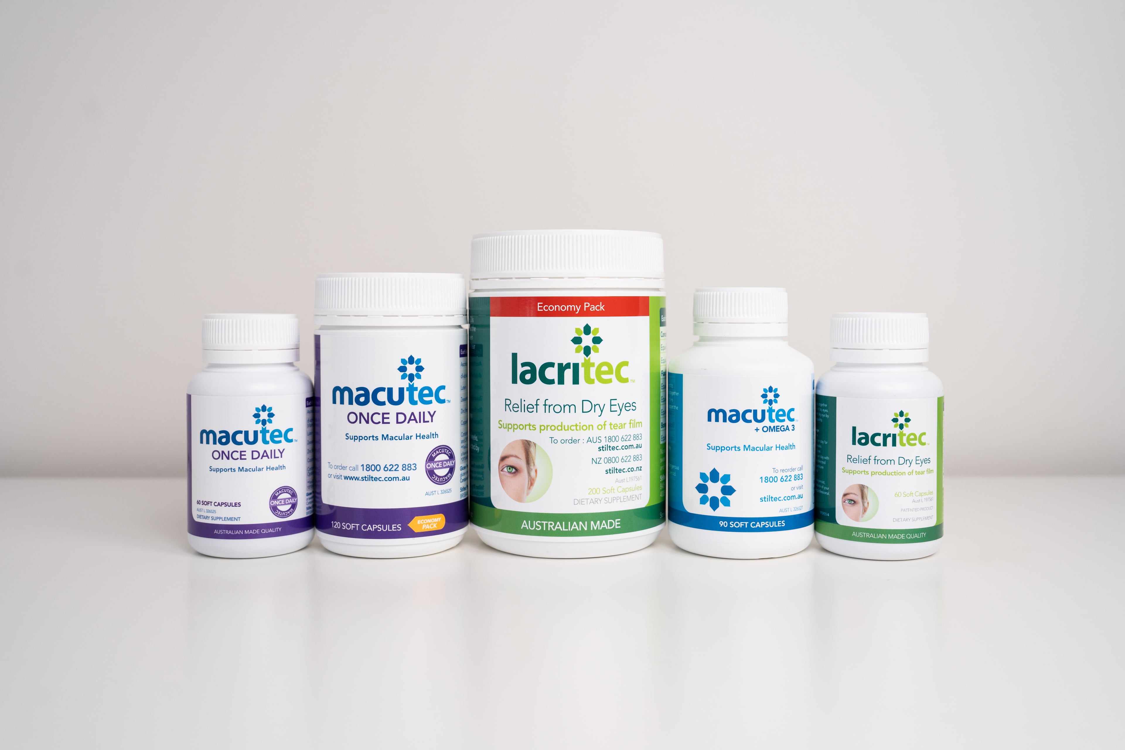 Five bottles of macutec and lacritec products on a white surface with a white background