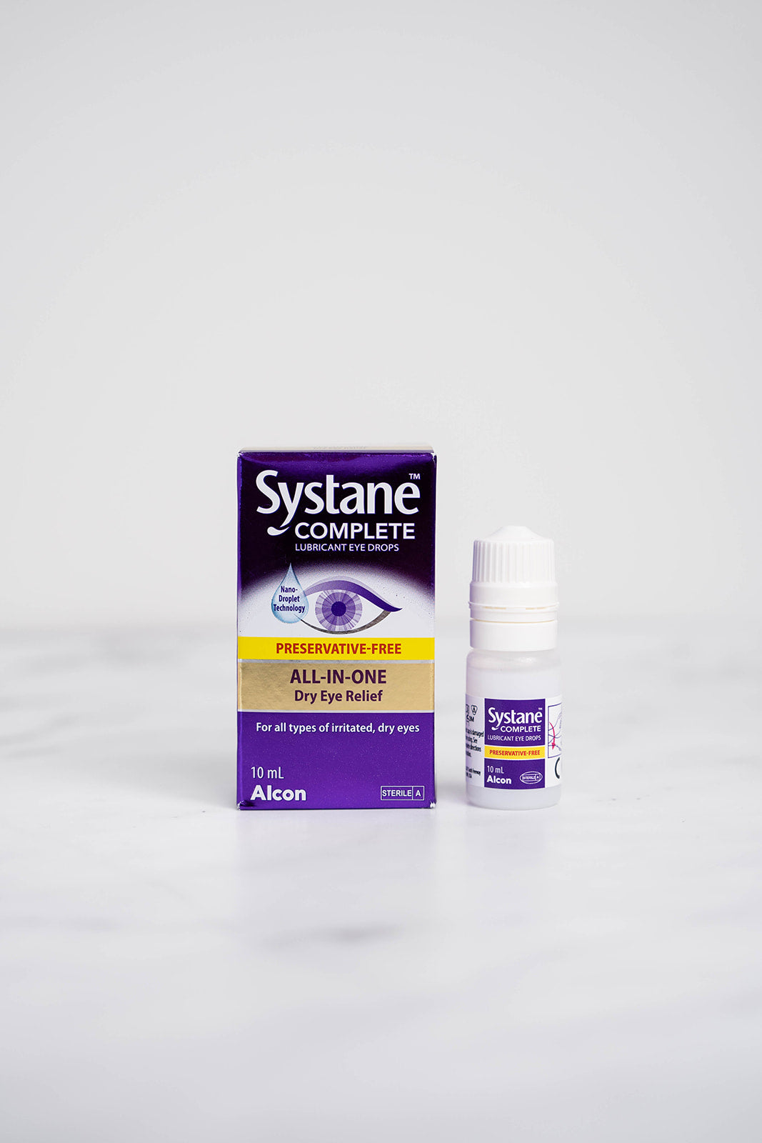 A 10ml bottle and box of Systane Complete Eye Drops for Dry Eyes.