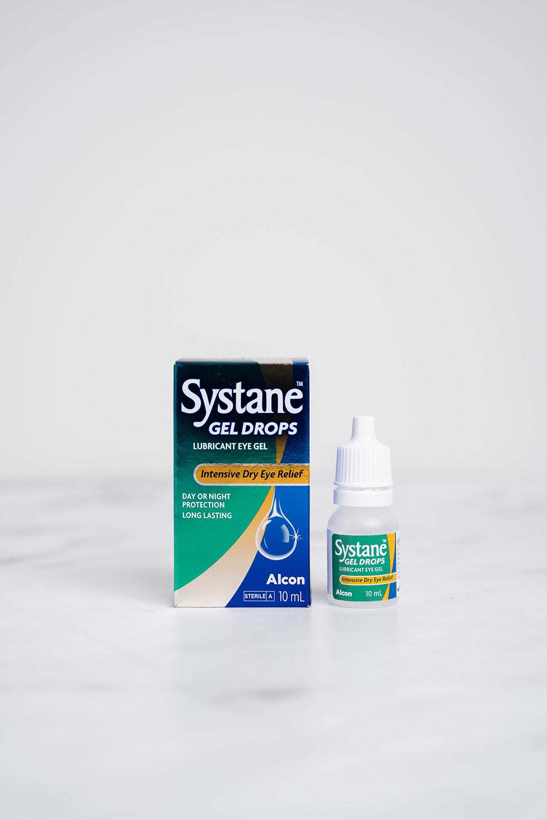 A 10ml bottle and box of Systane Gel Drops for Dry Eyes.