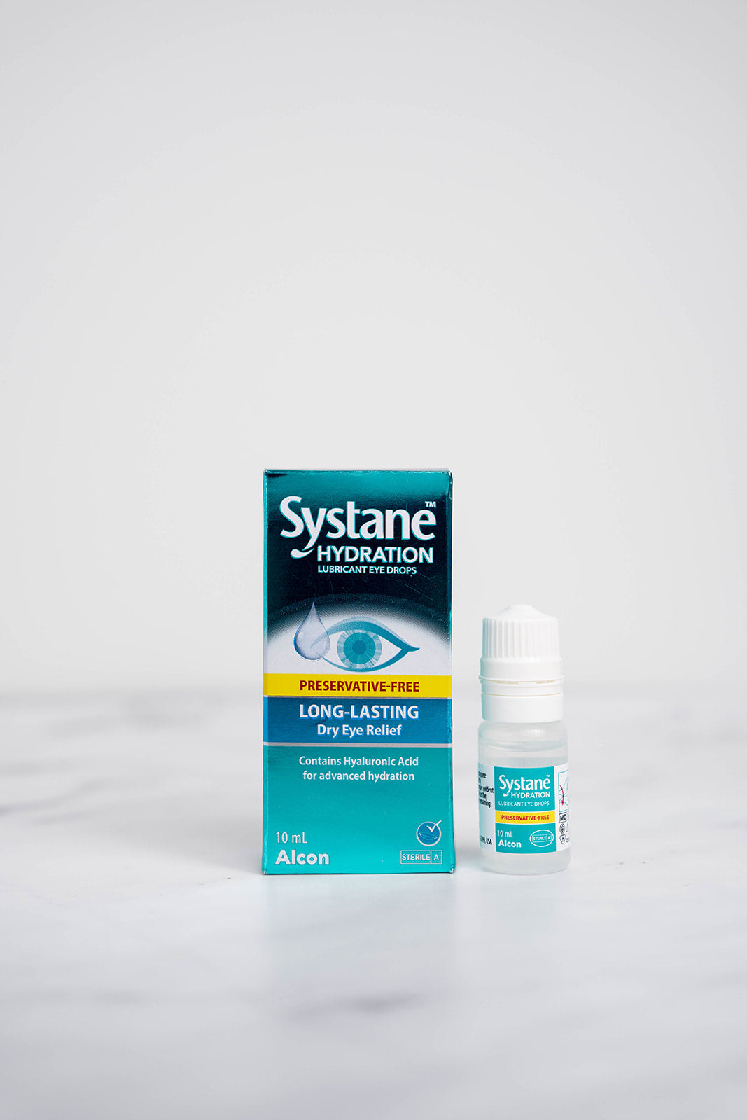 A 10ml bottle and box of Systane Hydration Drops for Dry Eyes.