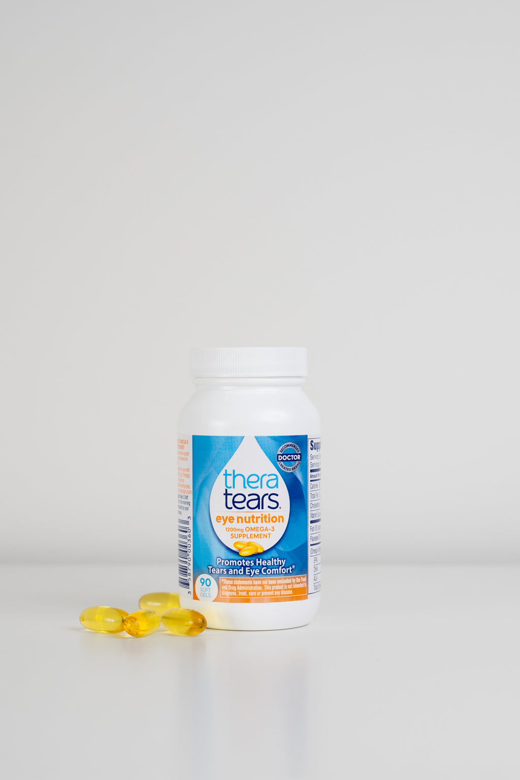 Thera Tears Eye Nutrition Omega-3 Dry Eye Supplement Bottle and pills on a white background.