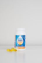 Thera Tears Eye Nutrition Omega-3 Dry Eye Supplement Bottle and pills on a white background.