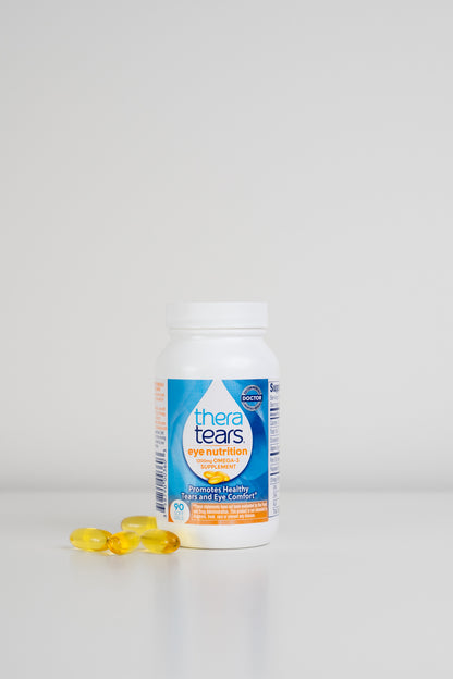 Thera Tears Eye Nutrition Omega-3 Dry Eye Supplement Bottle and pills on a white background.