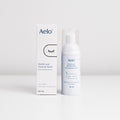 A bottle and box of Aelo Eyelid & Eyelash Foam Wash for blepharitis and MGD relief