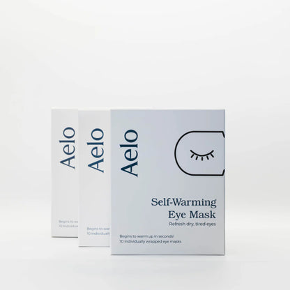 Three boxes of Aelo self-warming eye masks for dry eyes on a white background