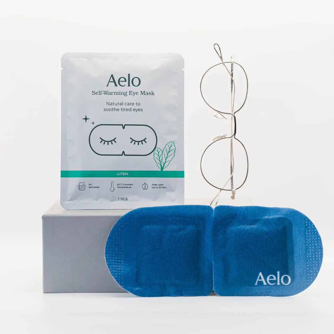 Aelo self-warming eye mask with lutein showing packaging and glasses on a white background