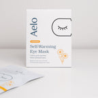 A box of Aelo Self Warming Eye Mask with Chamomile on a light grey background.