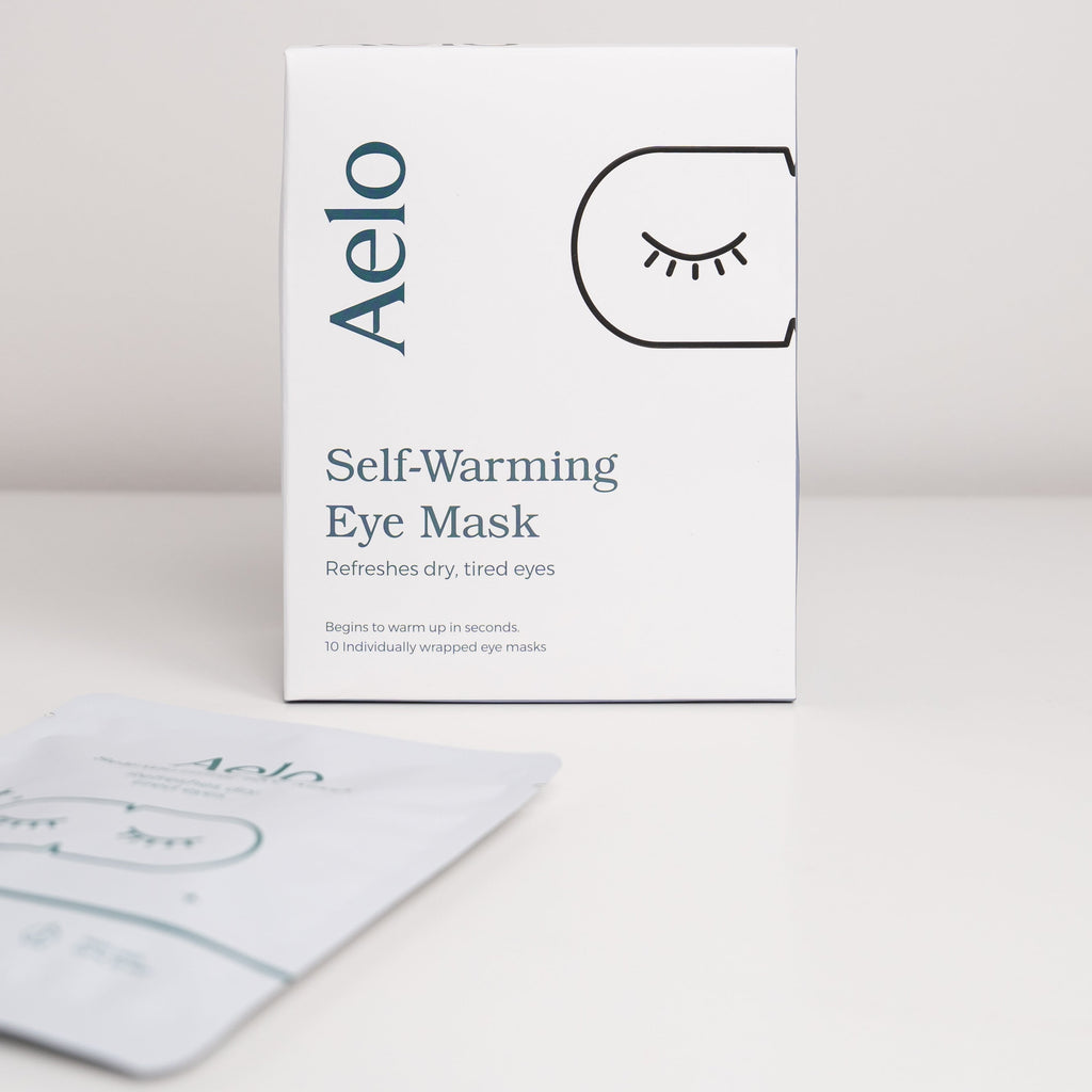 Aelo self-warming eye mask fragrance free packaging on a light gray background