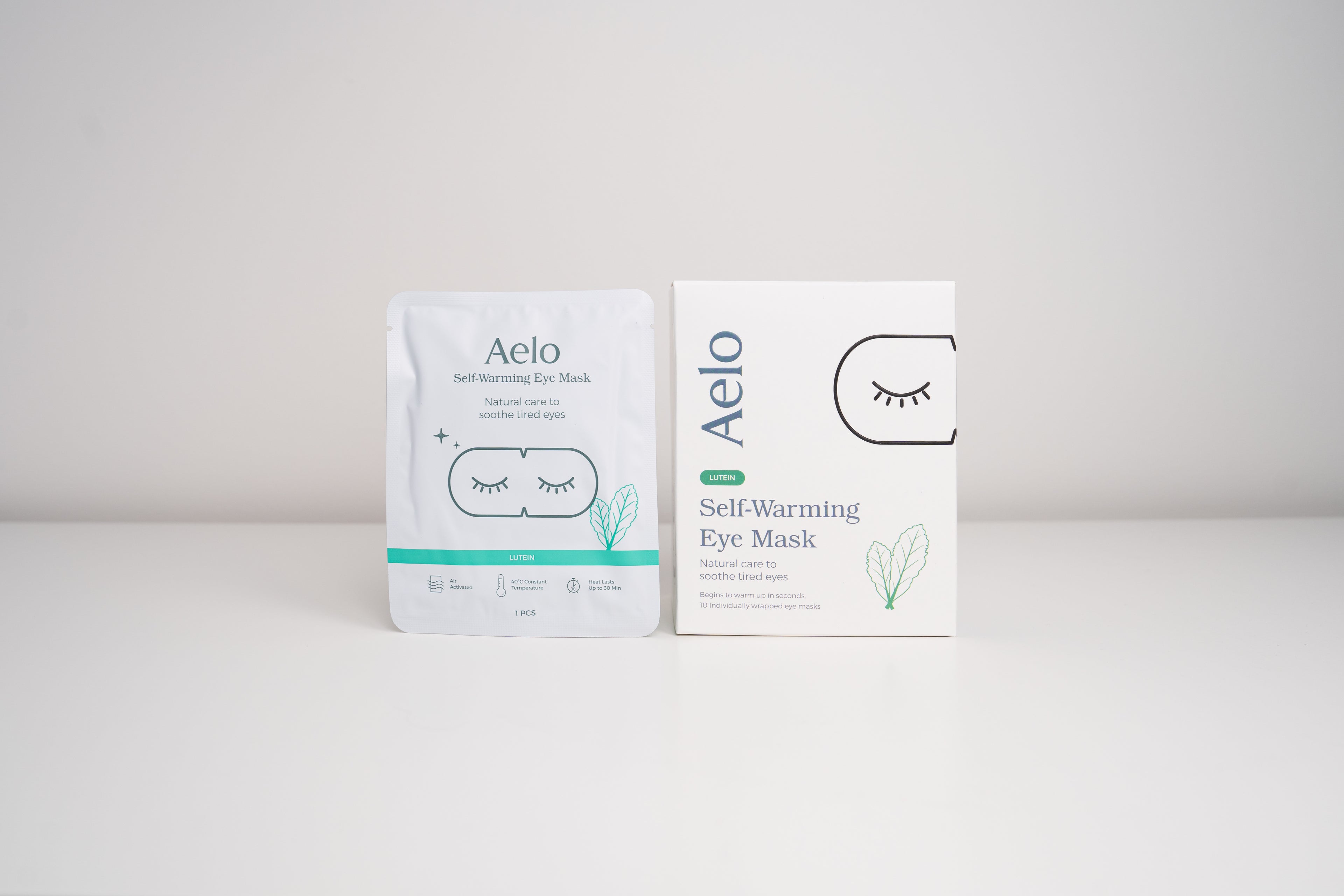 A box of Aelo self-warming eye masks with Lutein on a white background