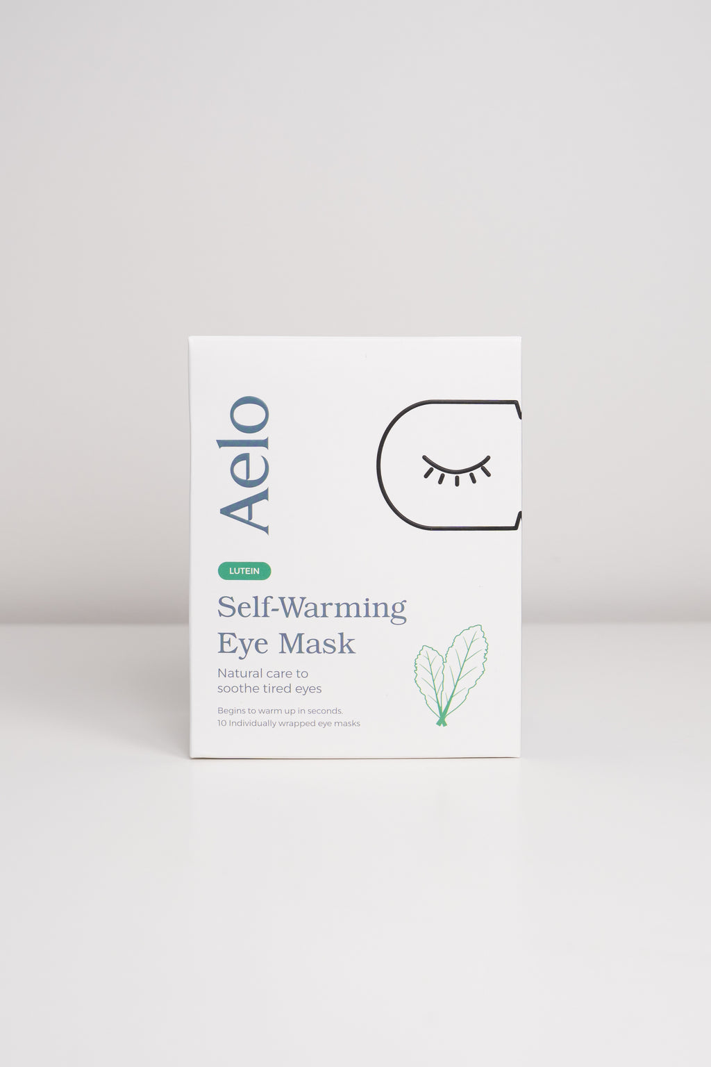 Aelo self-warming eye mask with Lutein packaging on a light gray background