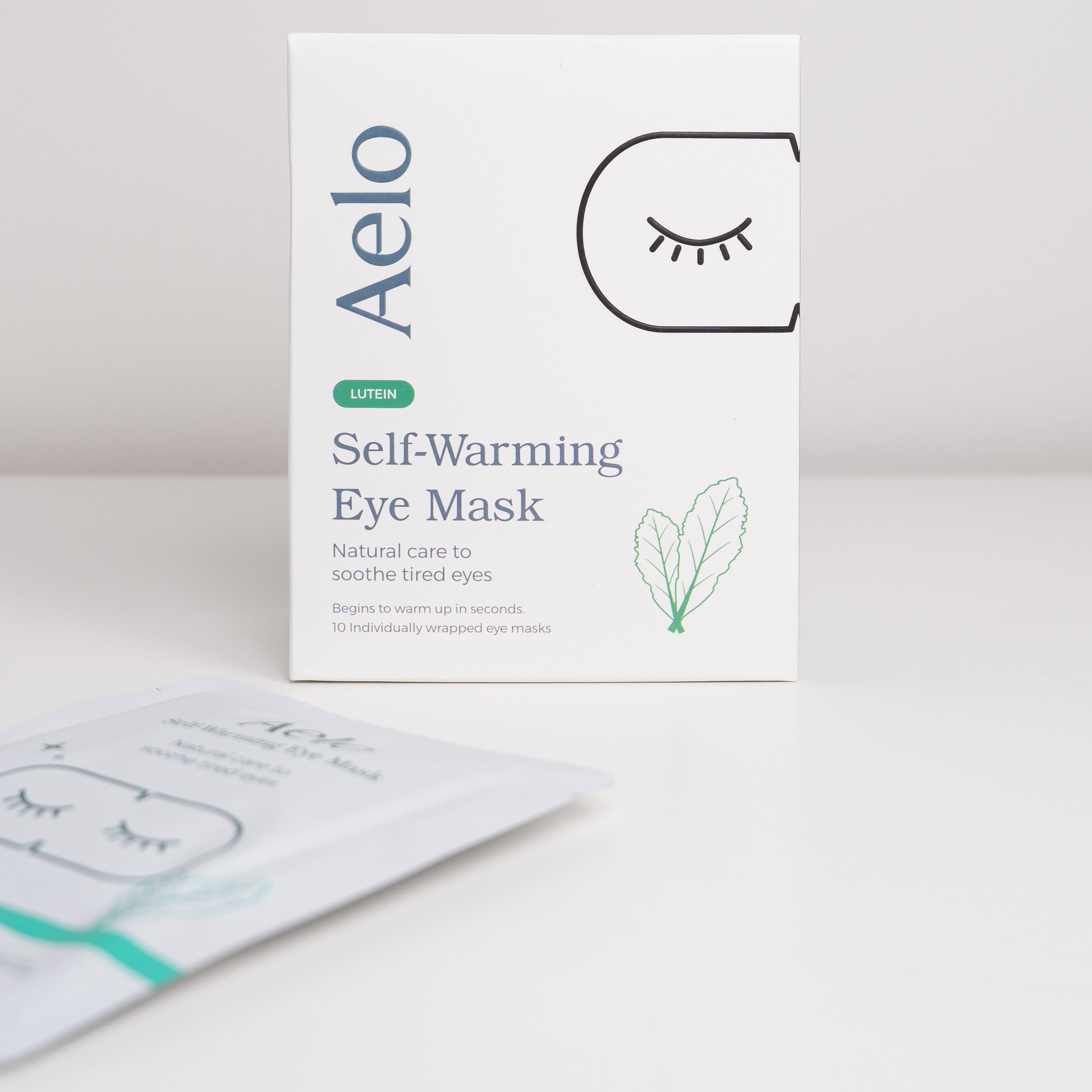 Aelo self-warming eye mask with lutein packaging on a white background