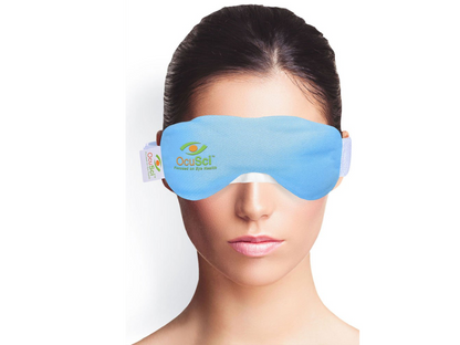 Person wearing a OcuSci E-Dry Eye Compress with a visible brand logo on a white background