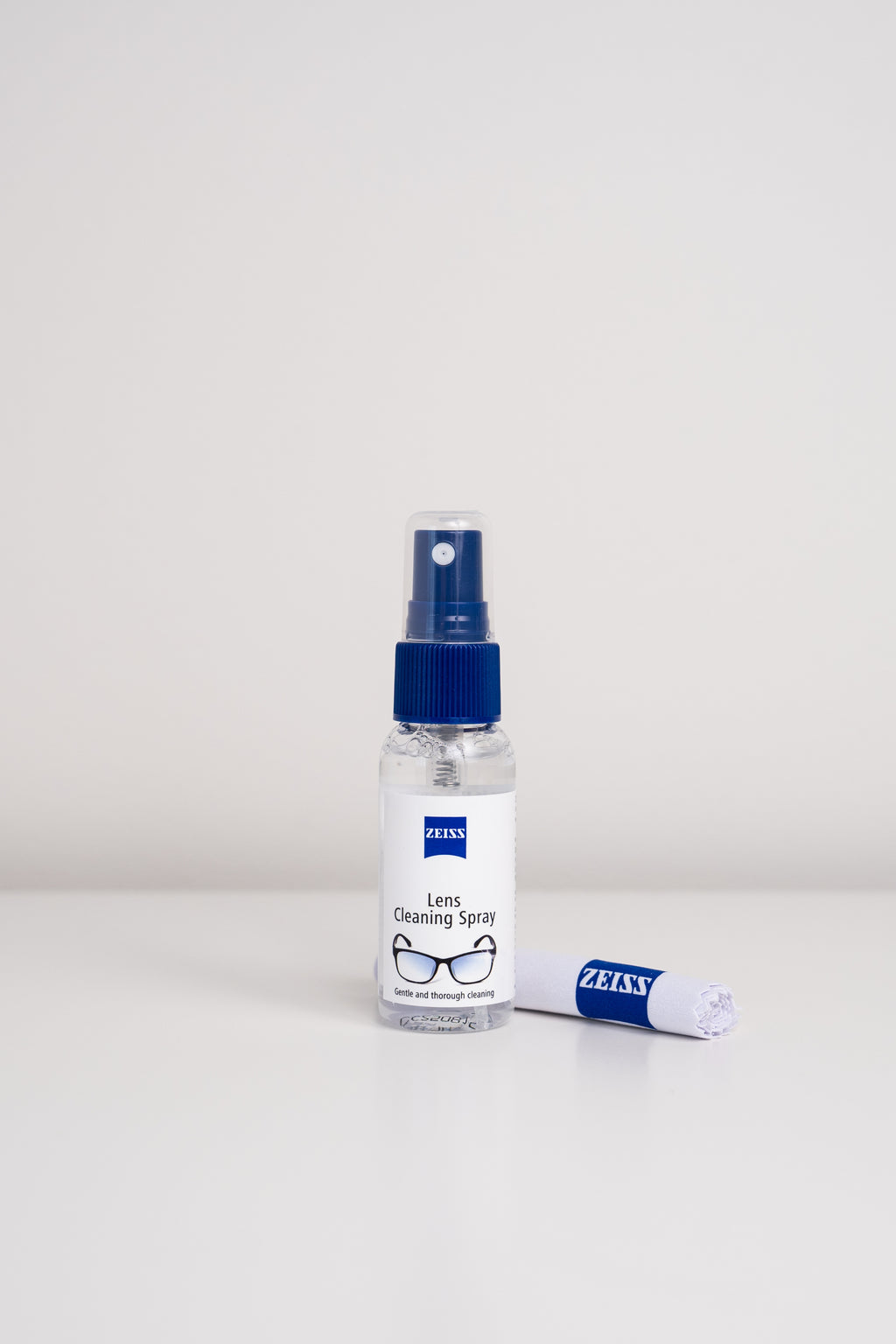 A bottle and cloth from the Zeiss lens cleaning kit, for cleaning eyeglasses and camera lenses.
